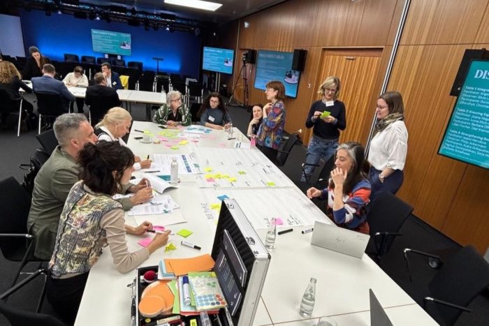 The participants at the Mutual Learning Exercise on SciComm in R&I in Berlin were divided into three groups, each with a subtopic, to discuss science communication in times of crisis and misinformation. The groups used silent brainstorming and post-its before engaging in the discussion.